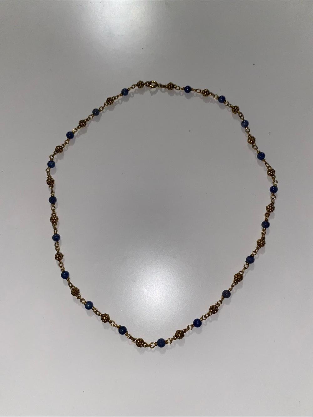 Gold Beaded Necklace with Blue Stone Accents